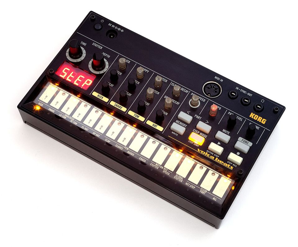 Korg Volca Beats seen from above at an angle, display showing STEP and the sixteen step keys lit.